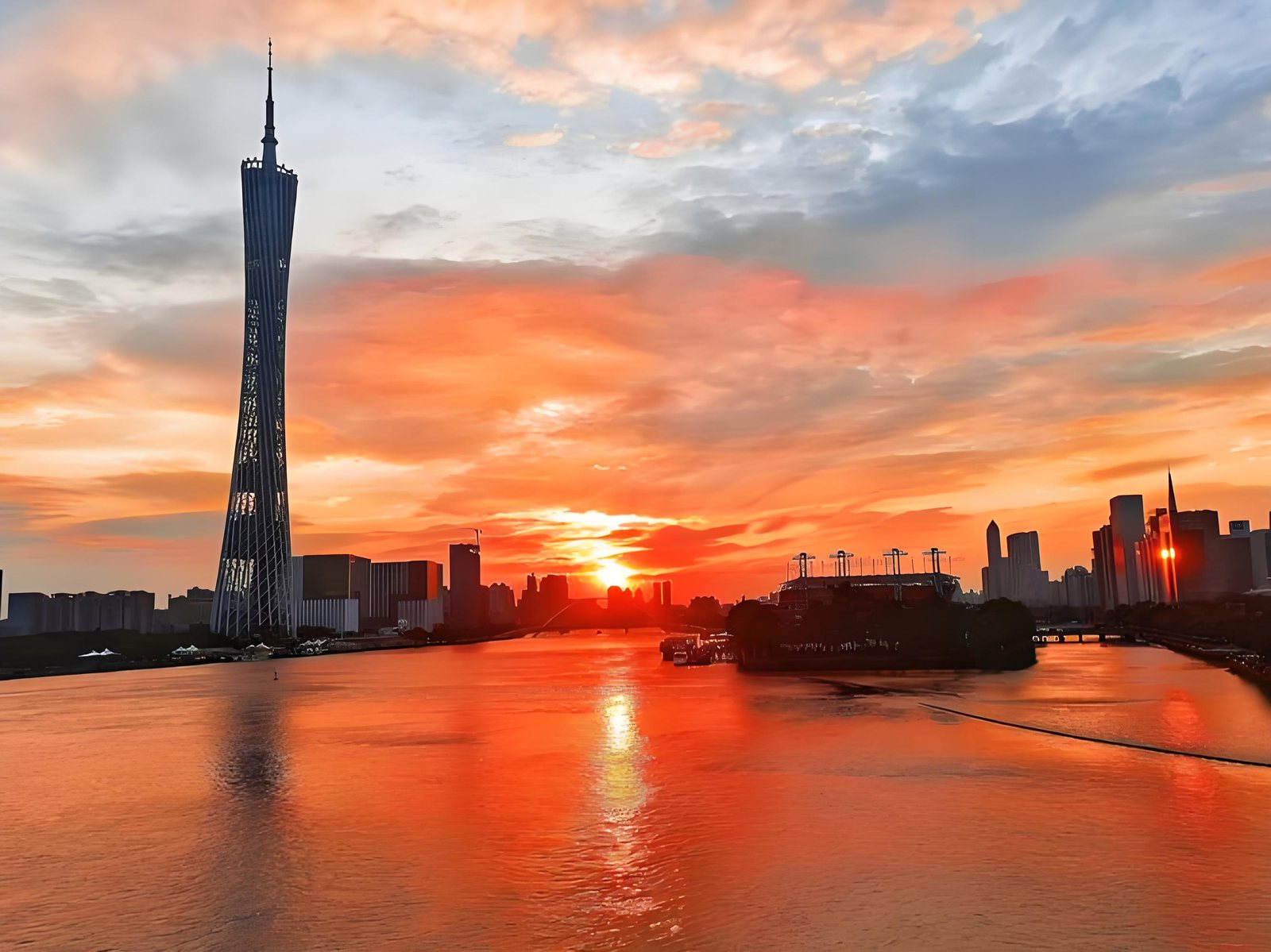 Canton Tower at sunset over the Pearl River
